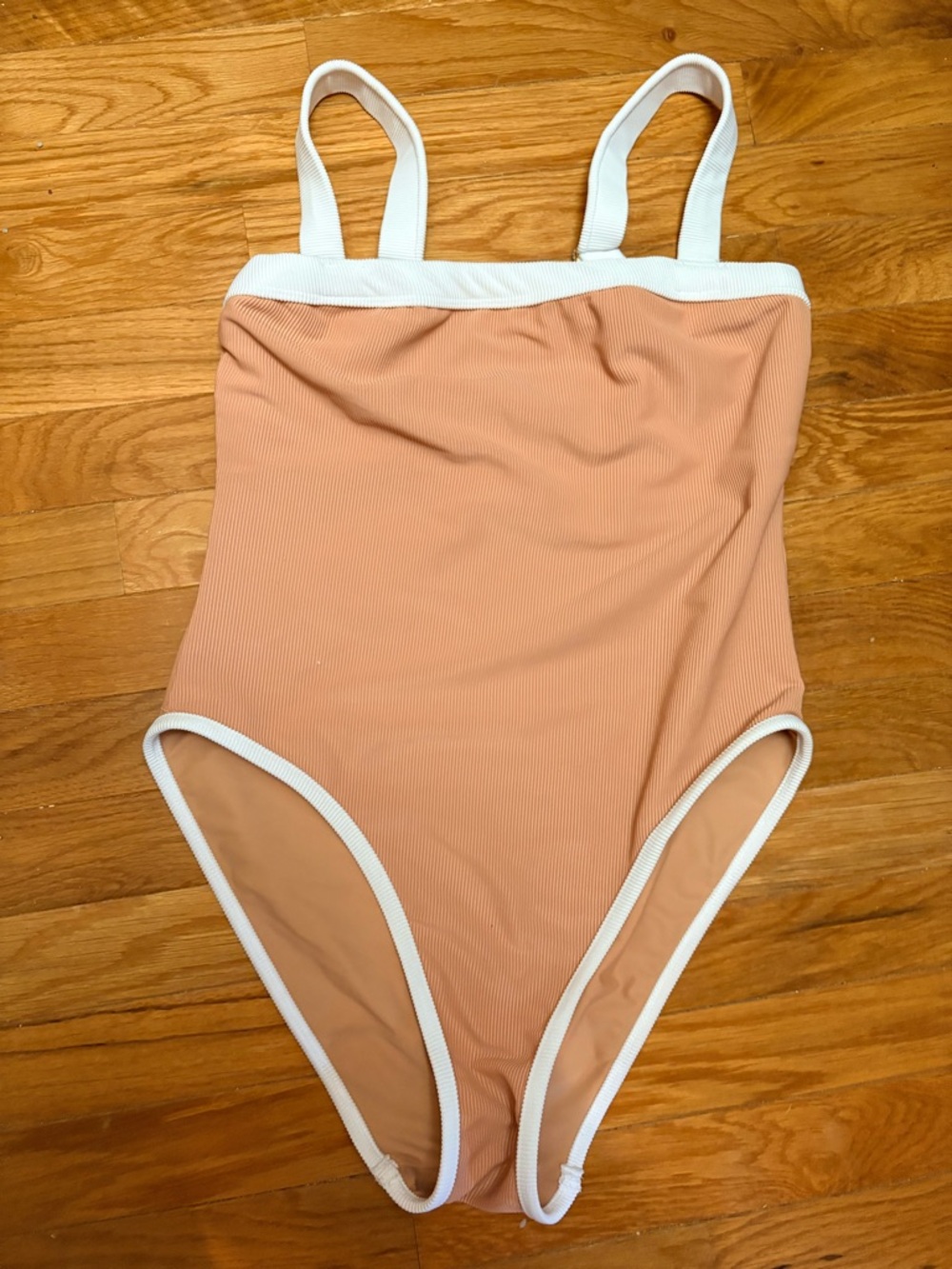 Blush lainsnow baywatch suit.  Ribbed One-Piece Swimsuit with White Trim
